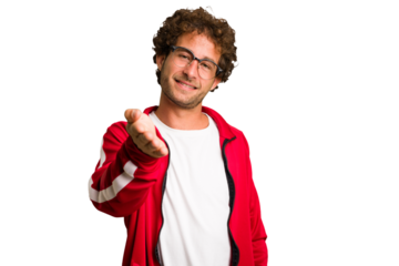 Young curly smart caucasian man cut out isolated stretching hand at camera in greeting gesture.