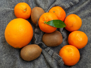 Clementines, kiwi, orange in grey