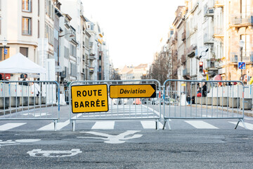 Route barree deviation translated as - closed street take other path - security gates over the main...