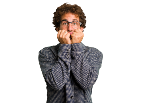 Young curly smart caucasian man cut out isolated biting fingernails, nervous and very anxious.