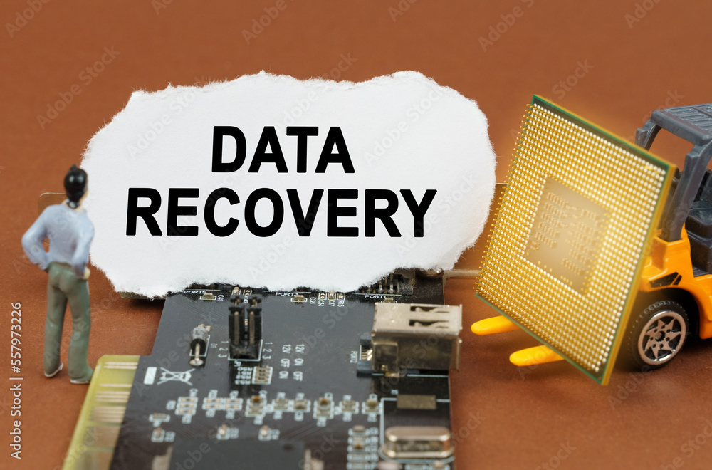 Poster on the board with microcircuits lies a paper plate with the inscription - data recovery