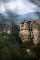 Blurred grass and high sandstone rock mountain peaks in Bulgaria, Belogradchik rocks