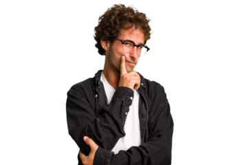 Young curly smart caucasian man cut out isolated contemplating, planning a strategy, thinking about the way of a business.