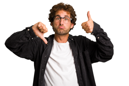 Young curly smart caucasian man cut out isolated showing thumbs up and thumbs down, difficult choose concept