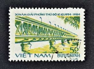 Cancelled postage stamp printed by Vietnam, that shows Thang Long bridge, Liberation of Hanoi, 30th Anniversary, circa 1984.