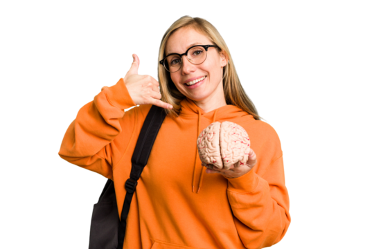 Young student caucasian woman holding a brain isolated showing a mobile phone call gesture with fingers.
