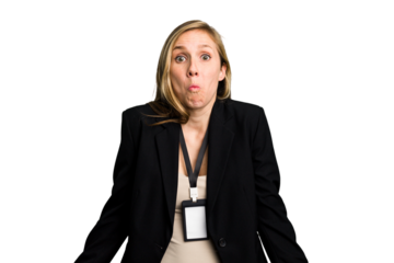 Young caucasian business woman with ID card isolated shrugs shoulders and open eyes confused.