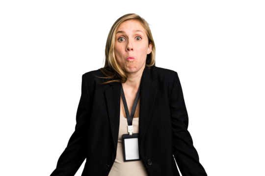 Young caucasian business woman with ID card isolated shrugs shoulders and open eyes confused.