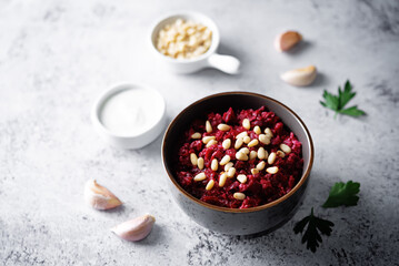Beetroot salad with pine nuts in a bowl
