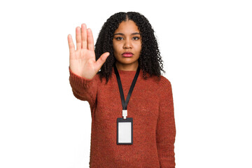 Young african american woman with ID card isolated standing with outstretched hand showing stop sign, preventing you.