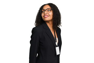 Young african american business woman with ID card isolated looks aside smiling, cheerful and...