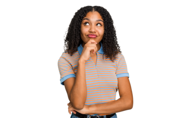 Young african american woman with curly hair cut out isolated relaxed thinking about something looking at a copy space.