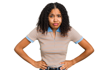Young african american woman with curly hair cut out isolated confused, feels doubtful and unsure.