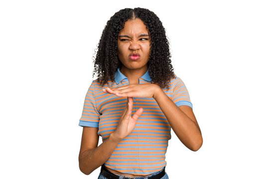 Young african american woman with curly hair cut out isolated showing a timeout gesture.