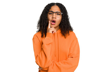 Young african american woman with curly hair cut out isolated looking sideways with doubtful and skeptical expression.