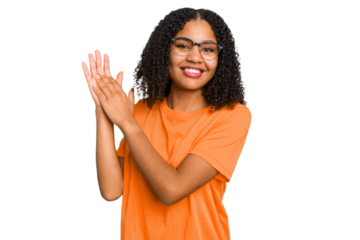 Young african american woman with curly hair cut out isolated feeling energetic and comfortable, rubbing hands confident.