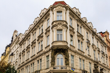 Corner of the house of classical European architecture of the old cozy tourist city. Background with selective focus