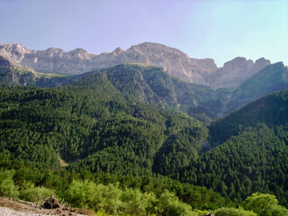 mountainous landscape of the Spanish Pyrenees. lots of green vegetation and high mountains.