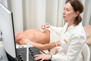Specialist conducts comprehensive examination of abdominal cavity
