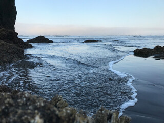 Seastacks, rocks and sea with foamy dreamy waves and ripples you can almost see this photo moving still