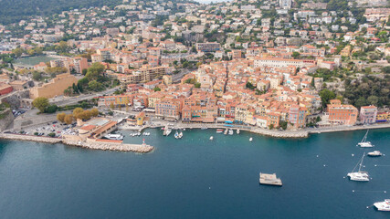 Aerial view on coast, marina and buildings in old Town Menton, France. Drone photo. High angle view of town