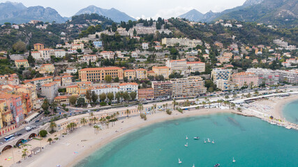 Aerial view on coast, marina and buildings in old Town Menton, France. Drone photo. High angle view...