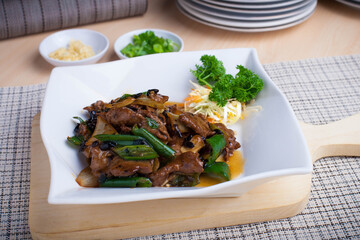 Asian cuisine spicy stir-fried beef with green chilies, very tasty and ready to serve