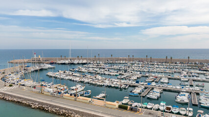 Aerial view on coast, marina and buildings in old Town Menton, France. Drone photo. High angle view of town