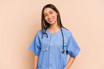Young nurse colombian woman isolated happy, smiling and cheerful.
