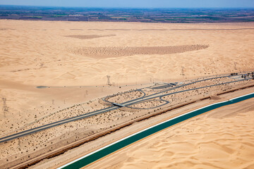 Aerial view looking SW from the All American Canal in California at the Imperial Sand Dunes and the U.S.-Mexico border wall