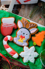 Box of Gingerbread Cookies on Wooden Background, Set of Christmas Treats