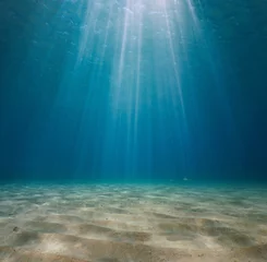 Foto op Aluminium Rays of sunlight underwater with a sandy seabed in the Mediterranean sea, Spain © dam