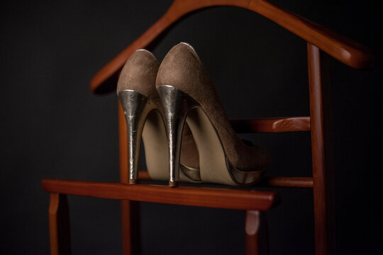 A detailed photo of an elegant pair of shoes - stilletos. 