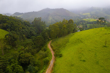 Mountains with fog at night arrival. Fog taking over the vegetation.