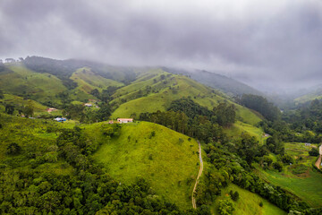 Mountains with fog at night arrival. Fog taking over the vegetation.