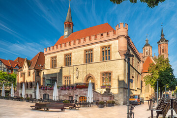 Obraz premium Close-up of the old town hall in Goettingen with the spiers of the Johannis Church in the background