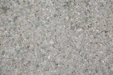 Gray stone wall made of pebbles, background, texture, backdrop