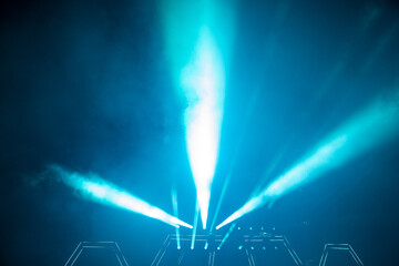 Light show. Laser show. Night club, lights, smoke machine. Blue background