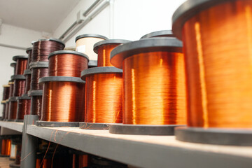 many coils of copper wire in the production workshop, winding copper cable on spools