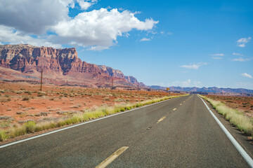 road in the desert with mountains