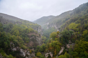 Steep slopes of a  deep gorge covered fog of the Cave city Khndzoresk, one of the most impressive and mysterious places in Armenia 