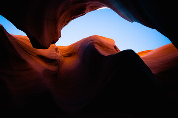 antelope canyon cliff walls with blue sky