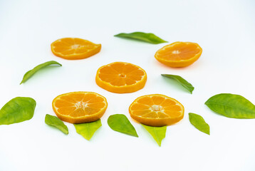 Close-up footage of orange and tangerine fruit on white background.