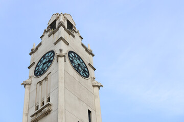 Old white chapel tower on blue background - old architecture 
