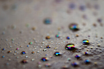 Close-up of bubbles on the surface of a cup of coffee, with a blurry background