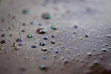Close-up of bubbles on top of a freshly brewed cup of coffee