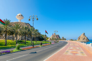 The Riyam incense burner, Old Watch Tower and Old Fort can be seen from the tiled sidewalks of the waterfront Corniche at Muscat, Oman.