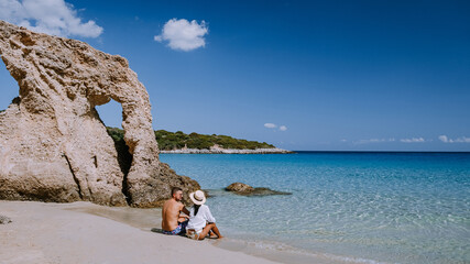 couple visit the Tropical beach of Voulisma beach, Istron, Crete, Greece during vacation,Most...