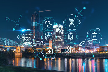 Panoramic view of Broadway district of Nashville over Cumberland River at illuminated night skyline, Tennessee, USA. Hologram healthcare digital medicine icons. The concept of treatment from disease
