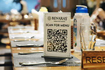 The menu has a QR code for customers to scan at an Indian restaurant in Da Nang